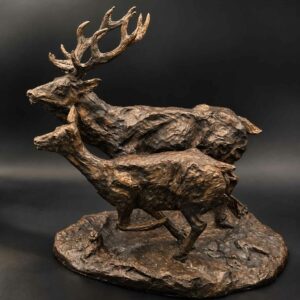 Venado y cierva en huída